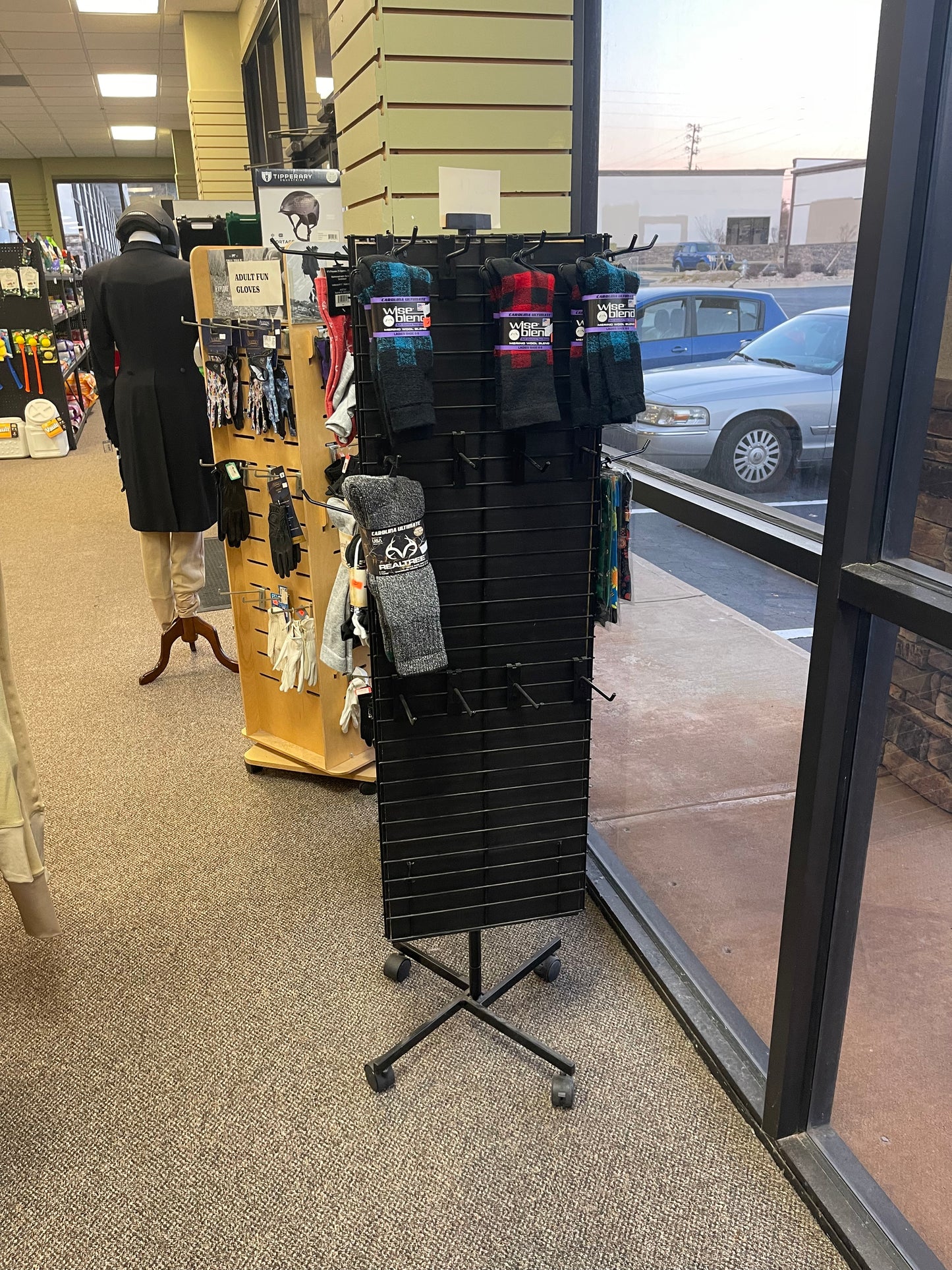 3 sided black spinner rack with grid hooks