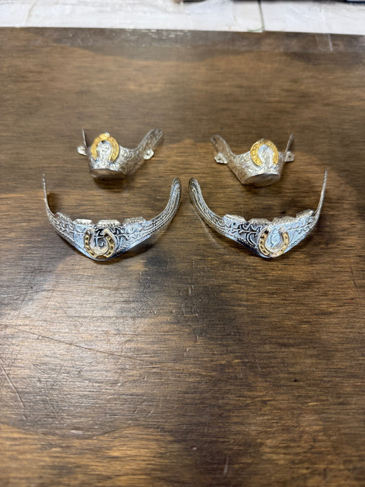 35. Silver boot tips set