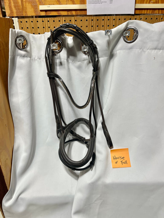 Full Havana brown Lumier bridle w/flash and clincher brow, with cheeks that fasten up and over the crown. One broken leather keeper on throatlatch (pictured)