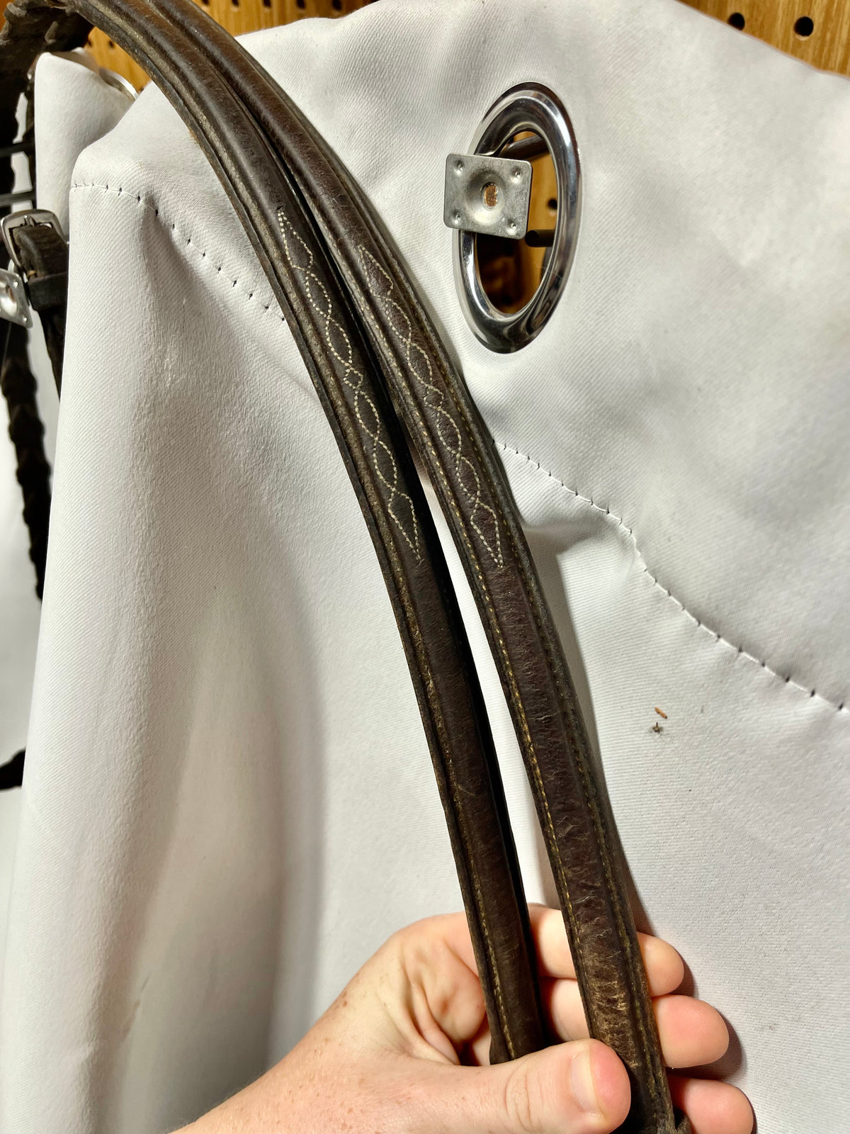 56” Brown raised fancy stitched laced English reins with double stitched bridle hook fastener ends, lightly used