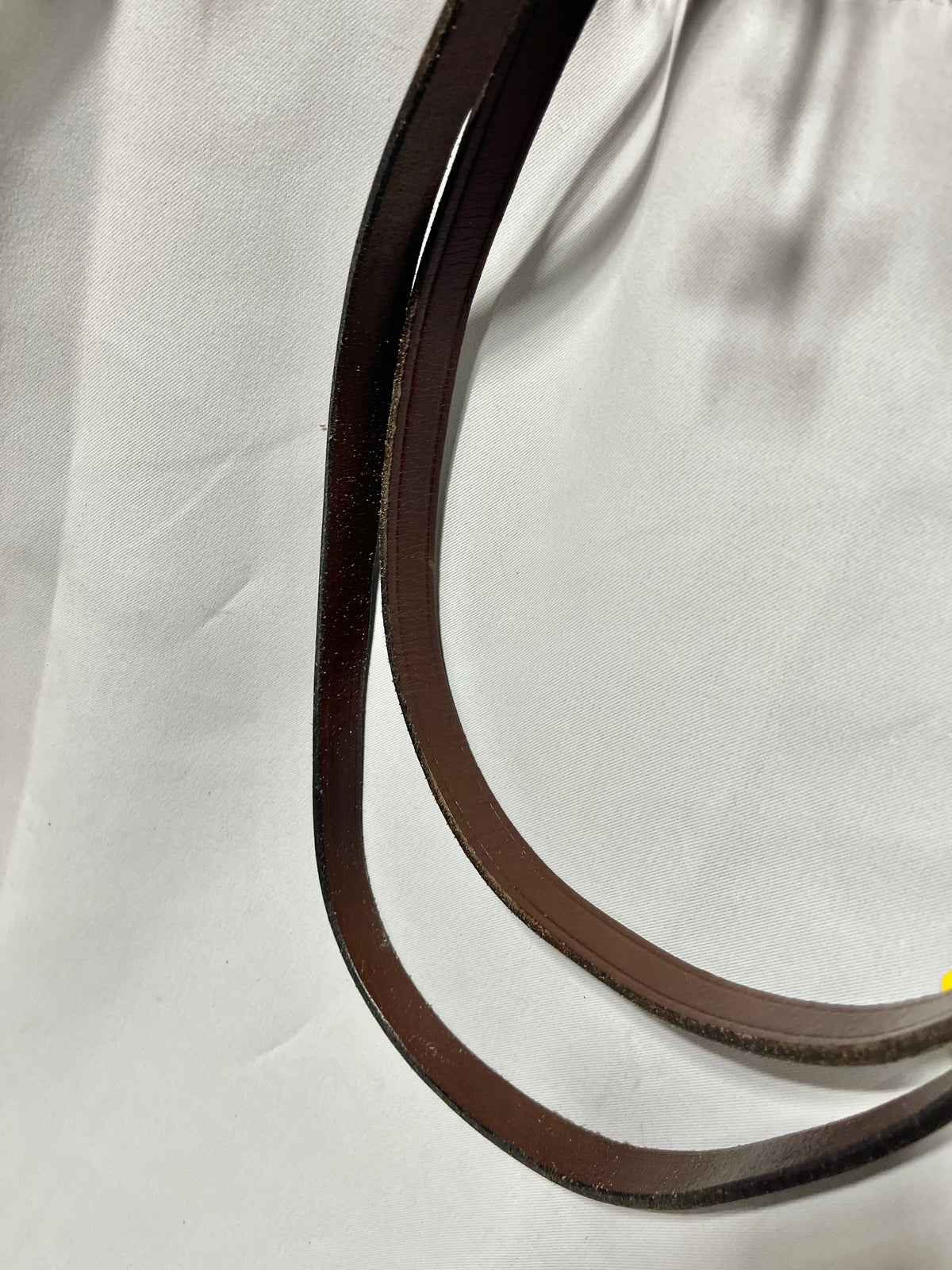 52" x 3/4” Red/Brown smooth leather English single reins, stitched center with no buckle, and with buckle ends