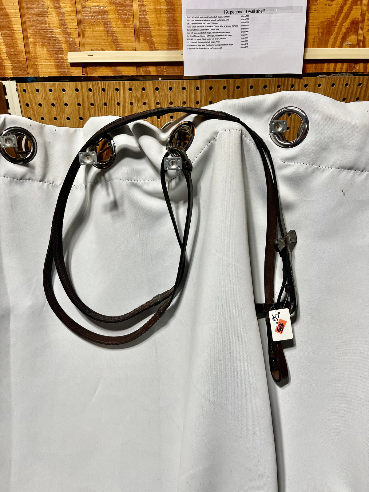 56" Kris brand Brown rubber English reins with stoppers on end and bridle hook end fasteners, like new